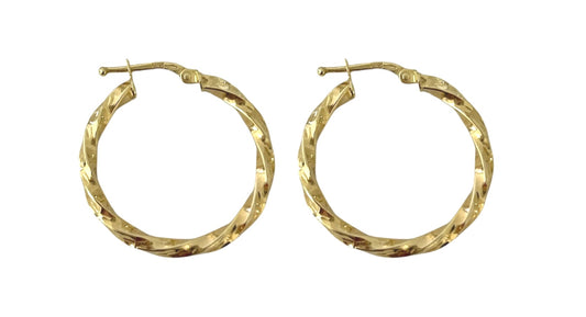 Gold hoop earrings on a white background