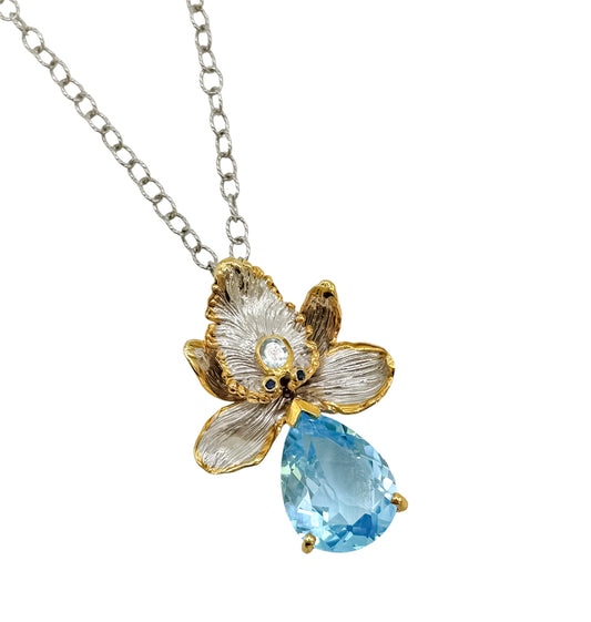 Silver Flower Necklace With Blue Topaz